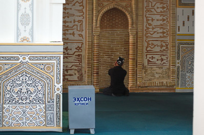 Man Praying in a Mosque