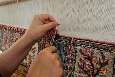 Woman Weaving a Silk Carpet