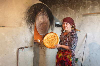 Woman Baking Uzbek Bread